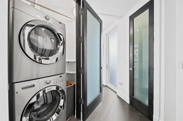 a view of a hallway with washer and dryer