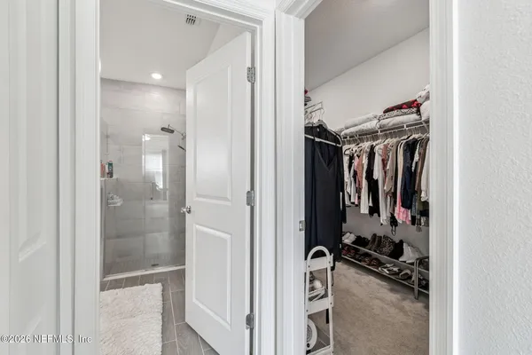 a spacious bathroom with a granite countertop sink mirror and toilet