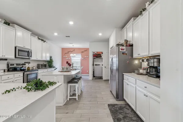 a bathroom with a sink a toilet and vanity