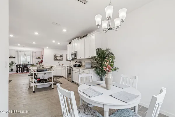 a spacious bedroom with a bed and a couch