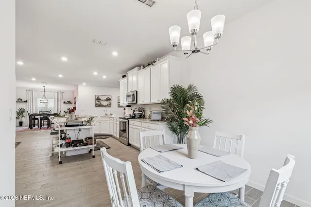 a spacious bedroom with a bed and a couch