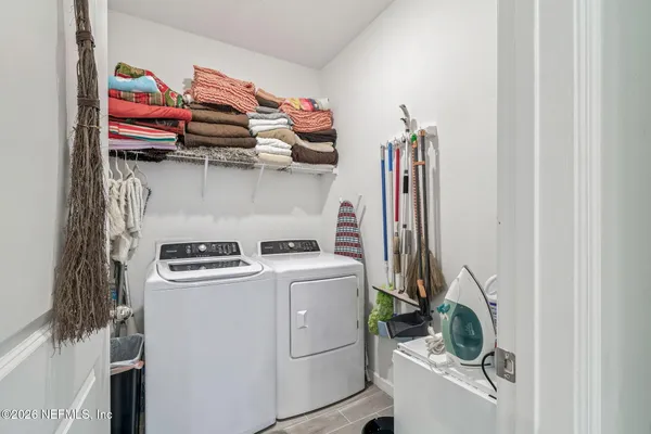 a bedroom with bed and a couch