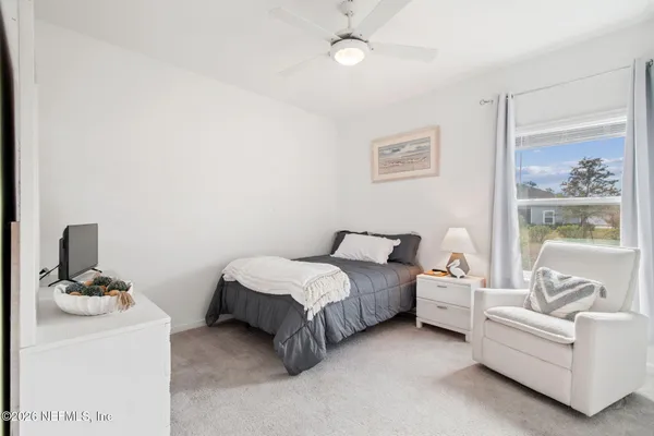 a bathroom with double vanity sink and a mirror