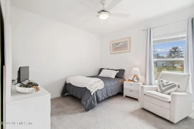 a bathroom with double vanity sink and a mirror