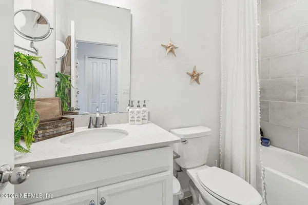 a view of an outdoor space and tennis court