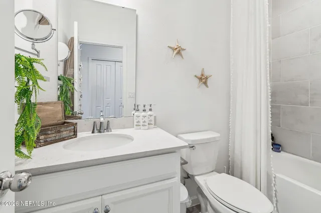 a view of an outdoor space and tennis court