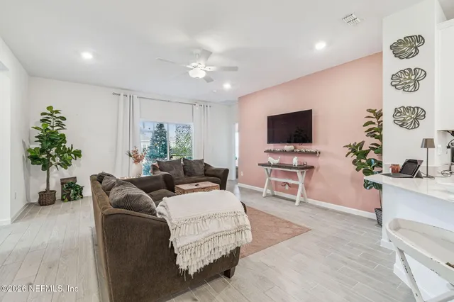 a living room with furniture or couch and a flat screen tv