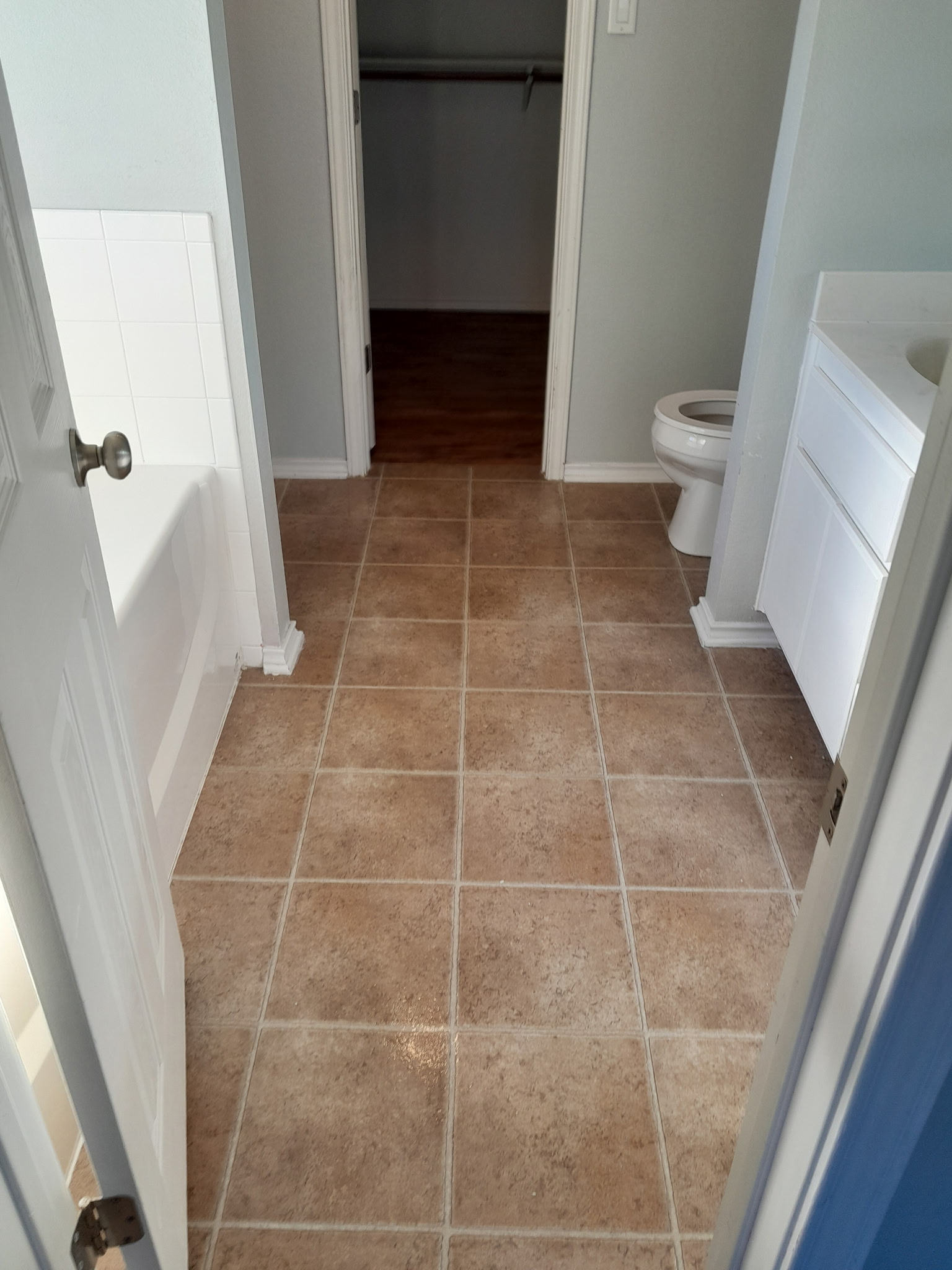 1309 Marlee Circle Copperas Cove, TX 76522 - Photo 13 of 16 Full bath featuring vanity, light tile patterned floors, a spacious closet, and a tub to relax in