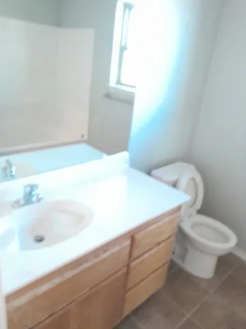 a bathroom with a sink and toilet