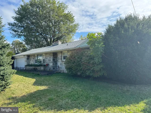a view of a house with a garden
