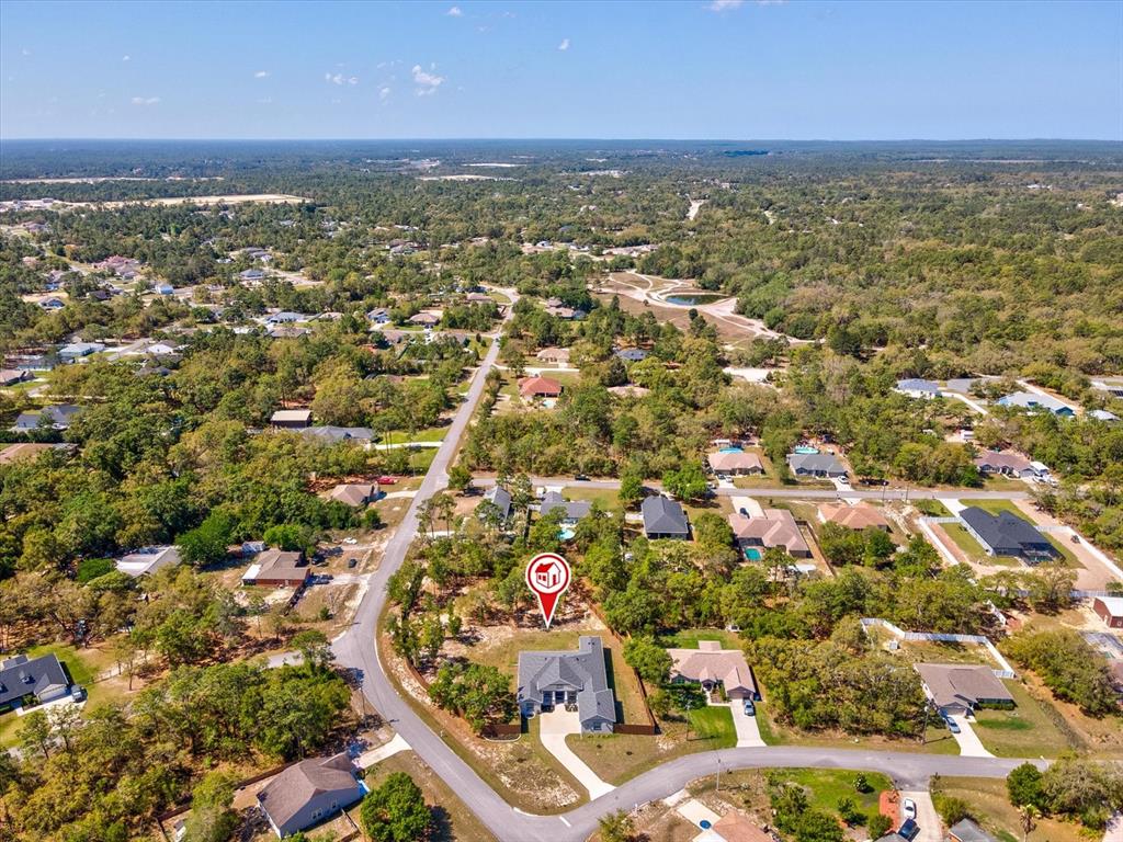 11981 Robina Road Weeki Wachee, FL 34614 - Photo 65 of 93 an aerial view of residential houses with outdoor space