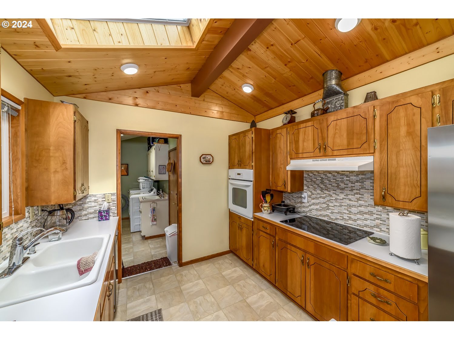 40157 York Lane Springfield, OR 97478 - Photo 13 of 41 a kitchen with stainless steel appliances kitchen island granite countertop a sink and cabinets