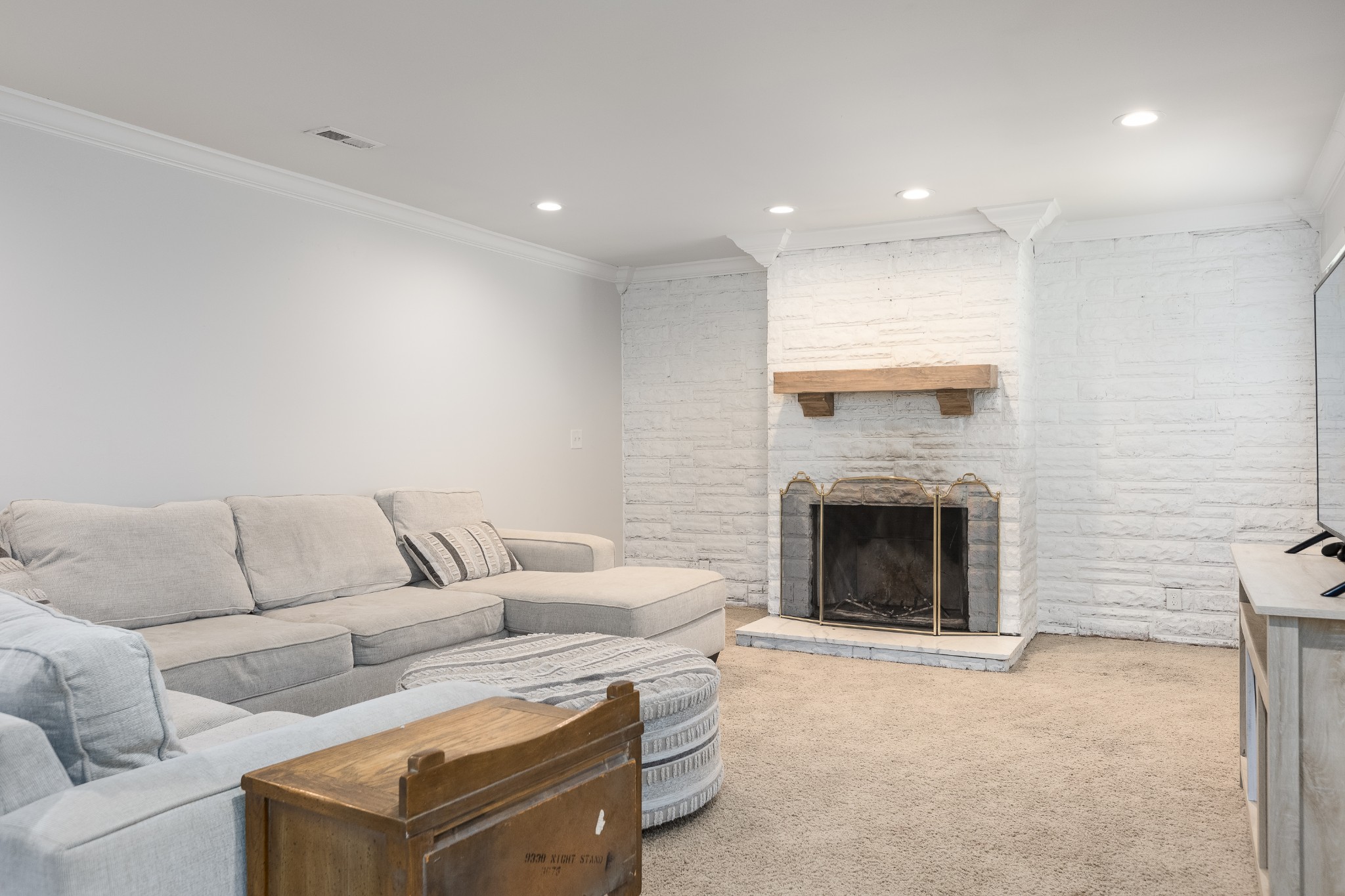 8884 Bethel Road Prospect, TN 38477 - Photo 8 of 41 a living room with furniture a fireplace and a flat screen tv