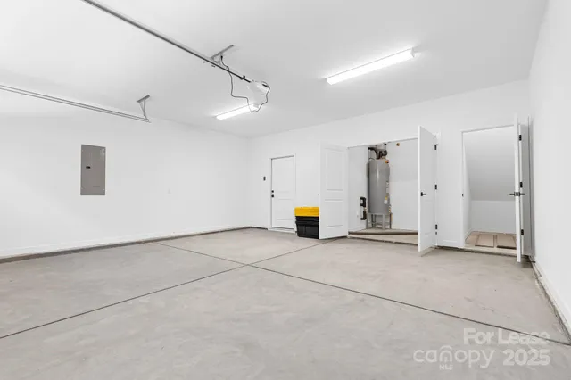 a view of a storage & utility room with two washing machine
