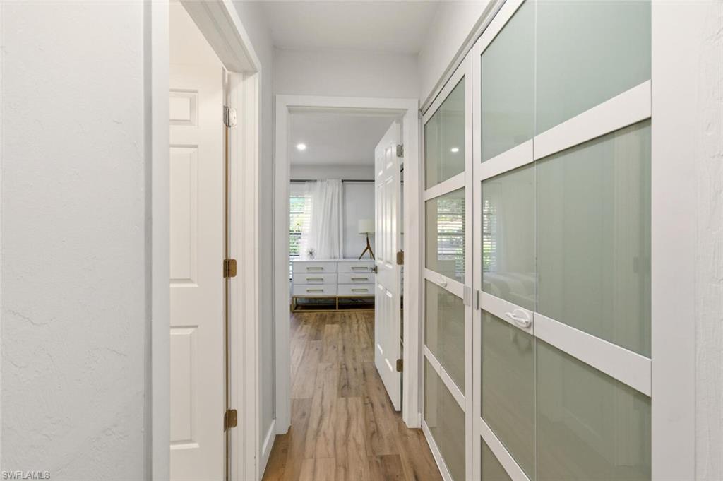 772 Reef Point Circle Naples, FL 34108 - Photo 17 of 46 a bathroom with a glass shower door
