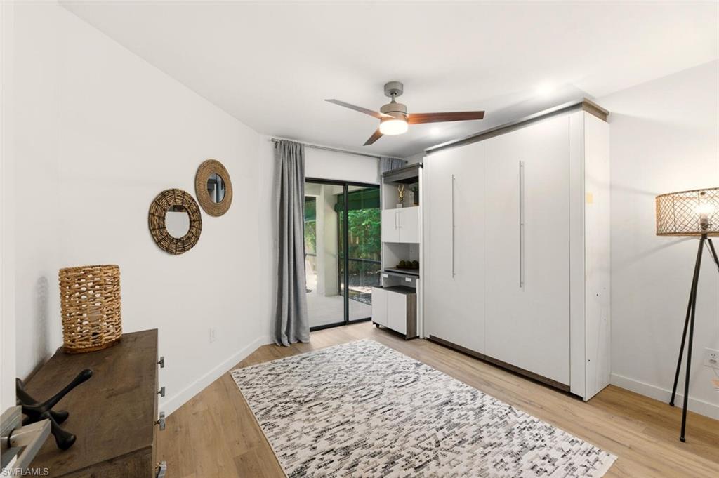 772 Reef Point Circle Naples, FL 34108 - Photo 18 of 46 a bedroom with a bed and a window