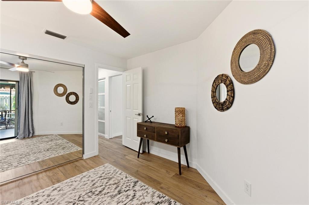 772 Reef Point Circle Naples, FL 34108 - Photo 19 of 46 a living room with furniture and a window