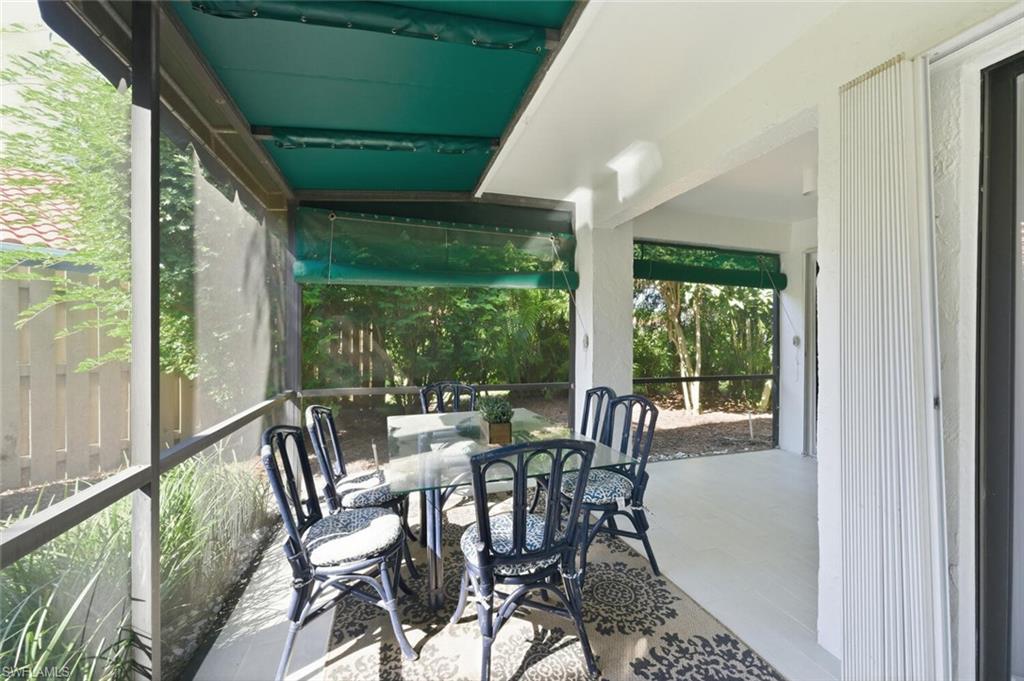 772 Reef Point Circle Naples, FL 34108 - Photo 24 of 46 a view of a dining room with furniture window and outside view