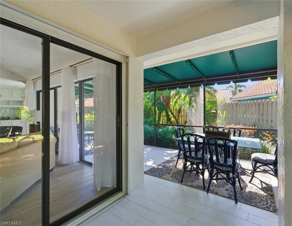 772 Reef Point Circle Naples, FL 34108 - Photo 25 of 46 a view of a dining room with furniture window and outside view
