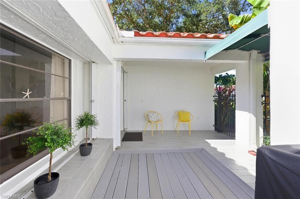 772 Reef Point Circle Naples, FL 34108 - Photo 32 of 46 a house view with a seating space