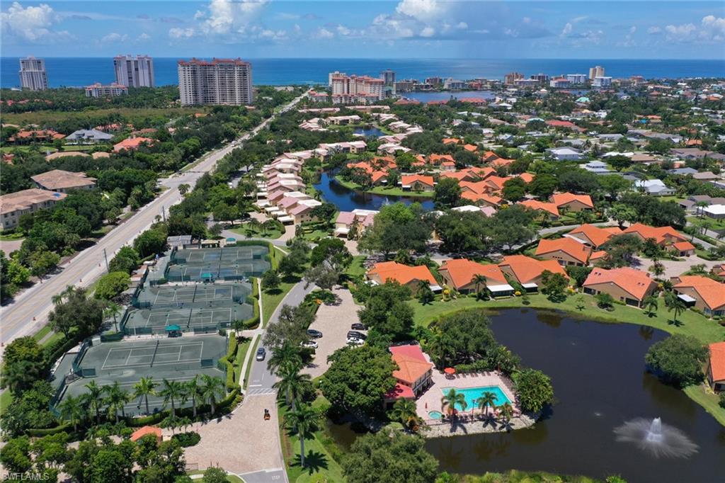 772 Reef Point Circle Naples, FL 34108 - Photo 45 of 46 an aerial view of residential houses with outdoor space