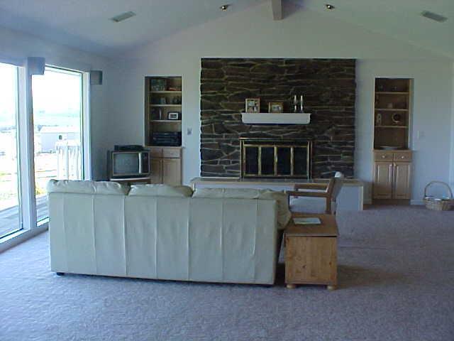 14208 Fisk Road Yakima, WA 98908 - Photo 3 of 9 a living room with furniture and a fireplace