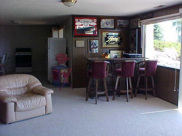 14208 Fisk Road Yakima, WA 98908 - Photo 6 of 9 a living room with furniture and a flat screen tv