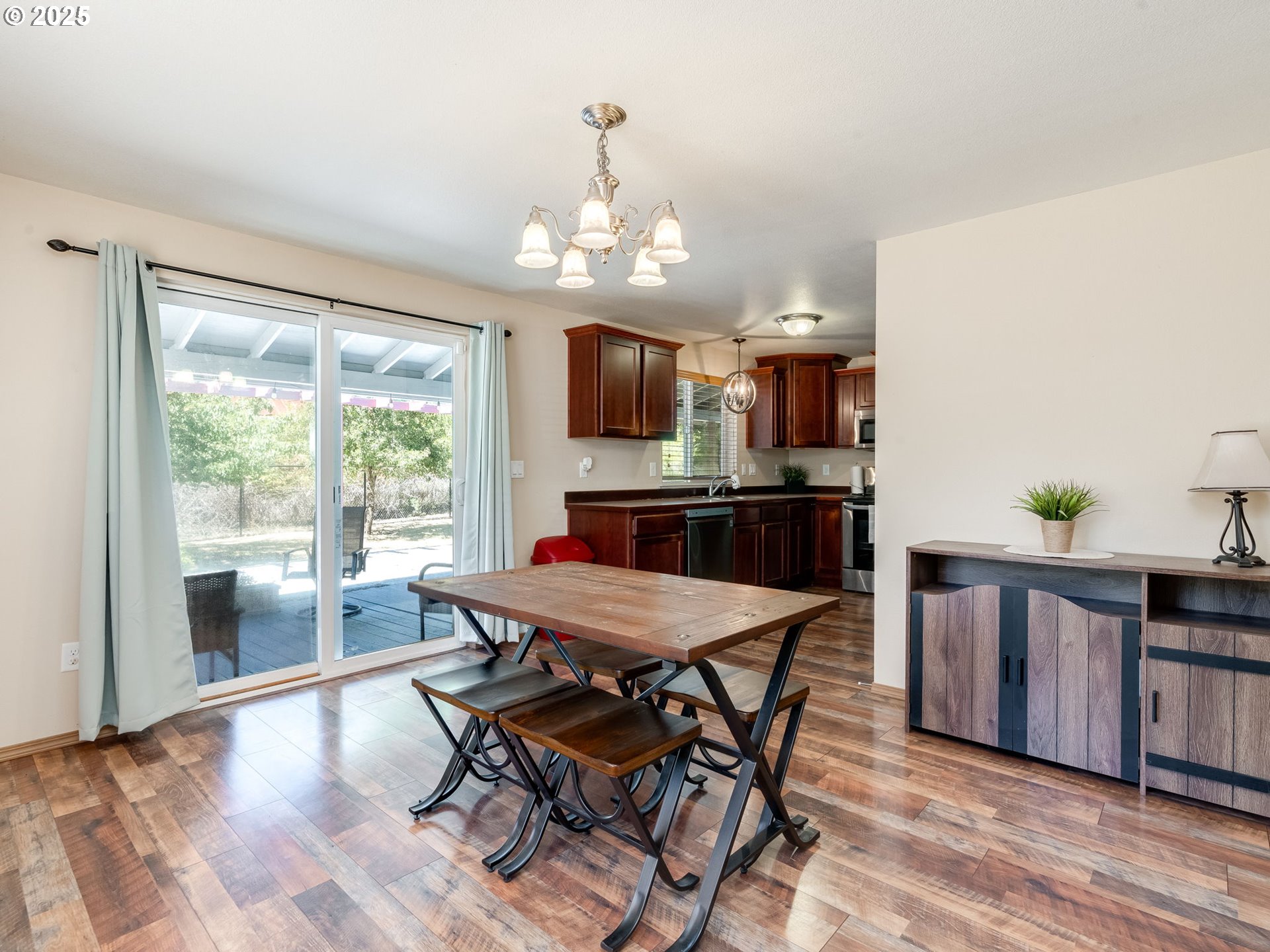 7575 Birch Street Grand Ronde, OR 97347 - Photo 14 of 48 a view of a dining room with furniture window and wooden floor
