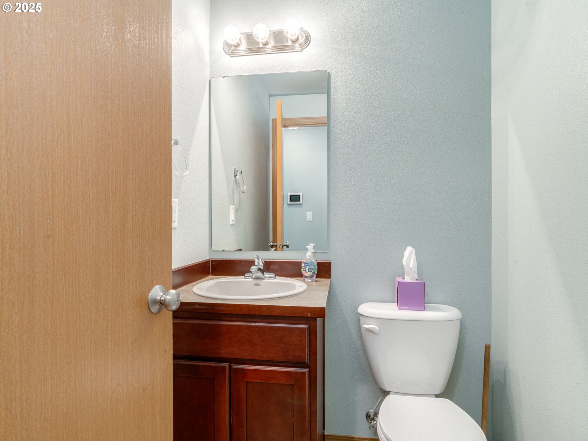 7575 Birch Street Grand Ronde, OR 97347 - Photo 18 of 48 a bathroom with a toilet sink and mirror