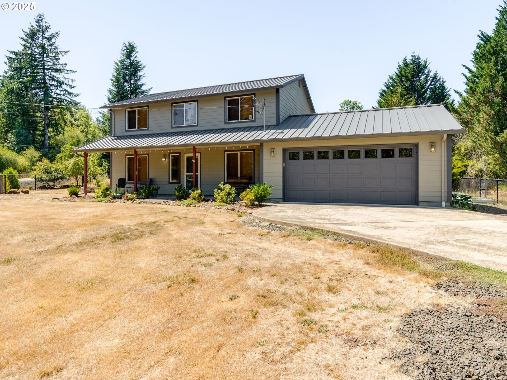 7575 Birch Street Grand Ronde, OR 97347 - Photo 3 of 48 a front view of a house with yard