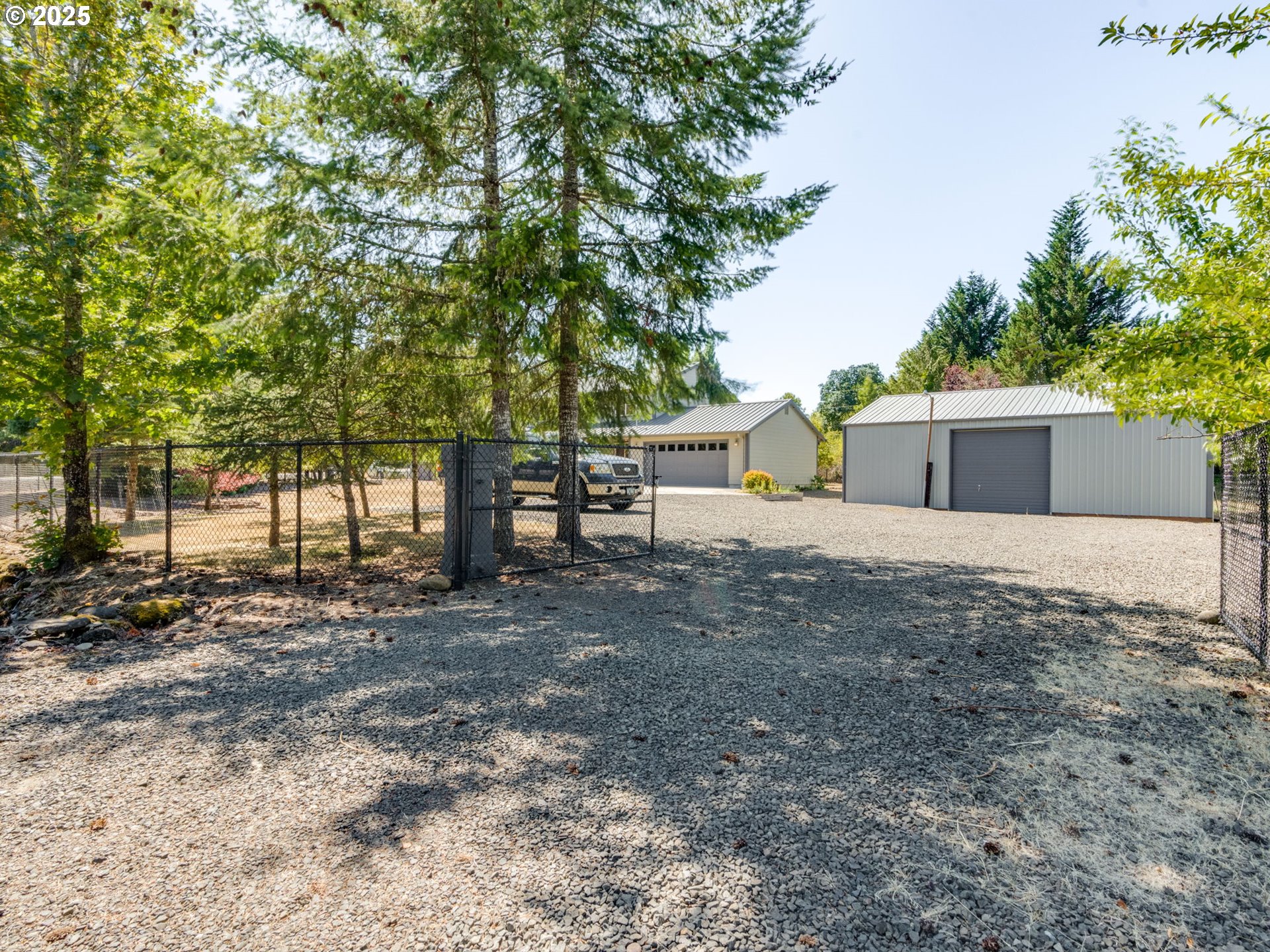 7575 Birch Street Grand Ronde, OR 97347 - Photo 35 of 48 a house with trees in front of it