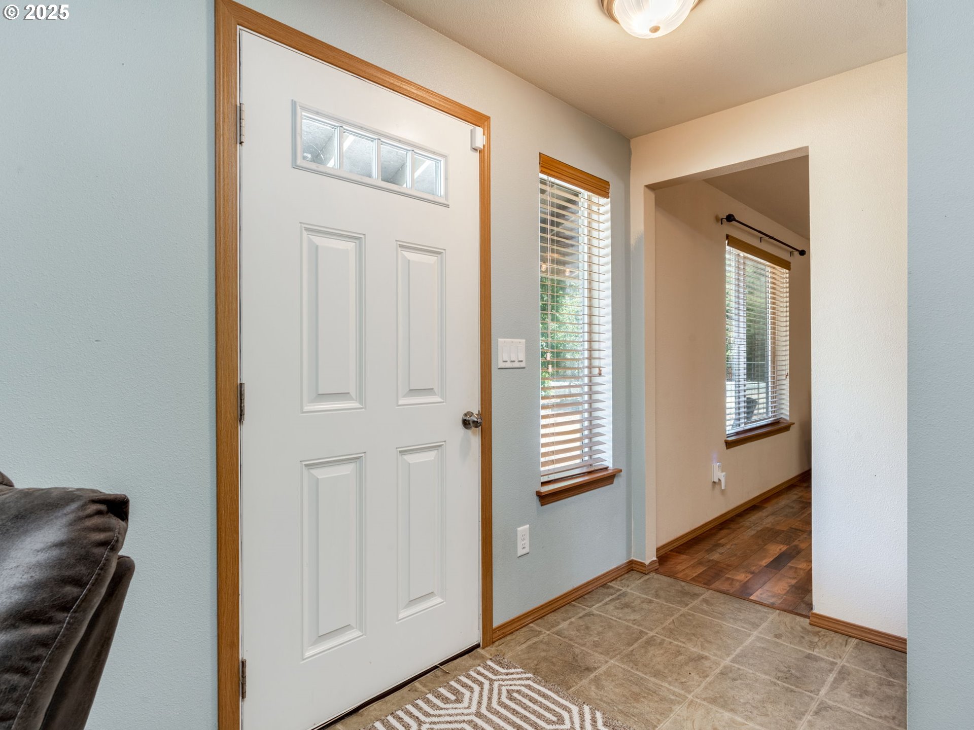 7575 Birch Street Grand Ronde, OR 97347 - Photo 5 of 48 a view of an empty room with wooden floor and a window