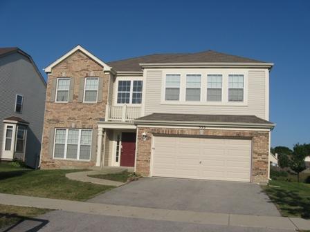 333 Stonegate Road Bolingbrook, IL 60440 - Photo 1 of 1 a front view of a house with a yard and garage