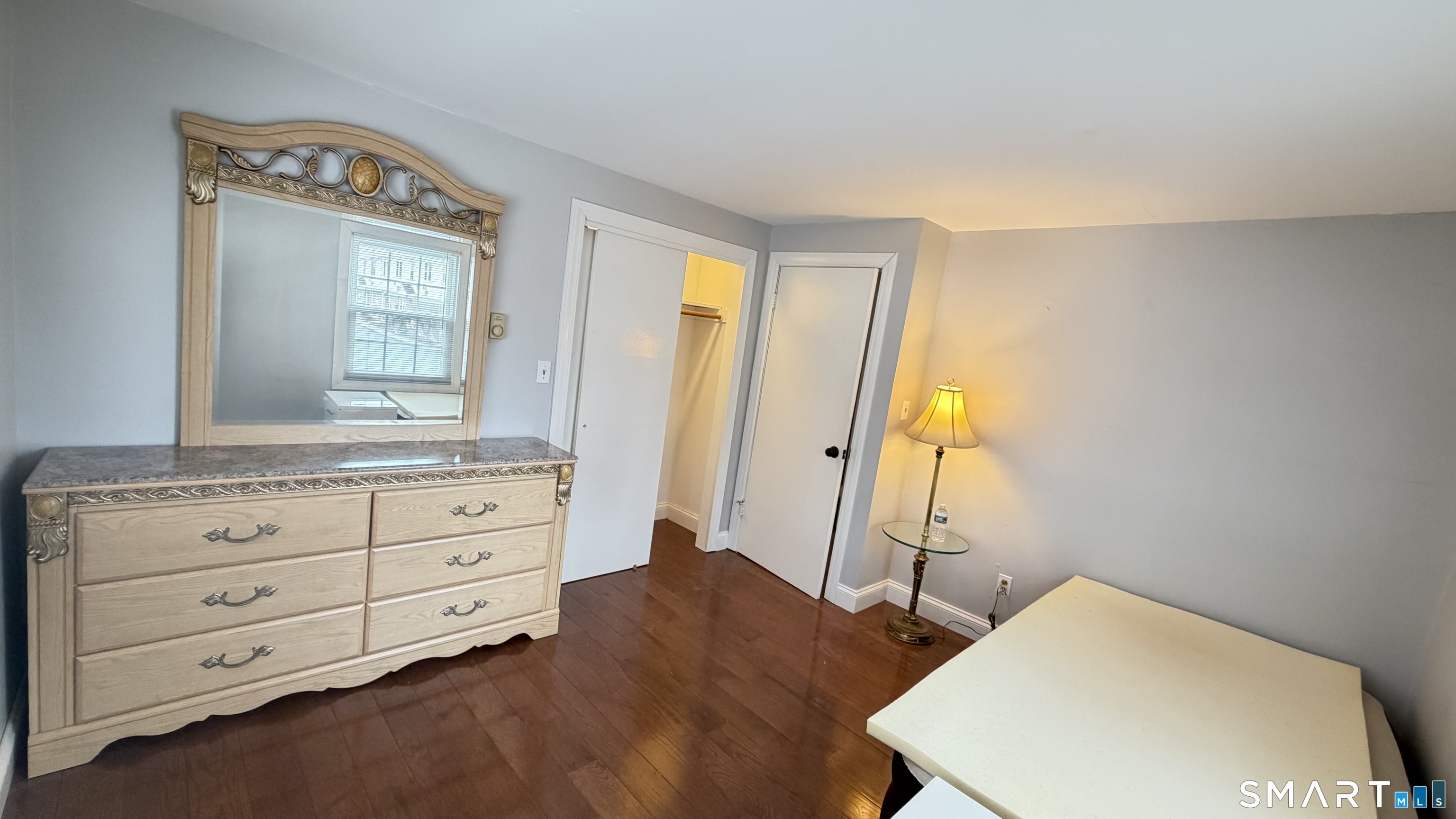 646 Howe Avenue, Unit 23 Shelton, CT 06484 - Photo 13 of 33 a bedroom with a bed and a dresser