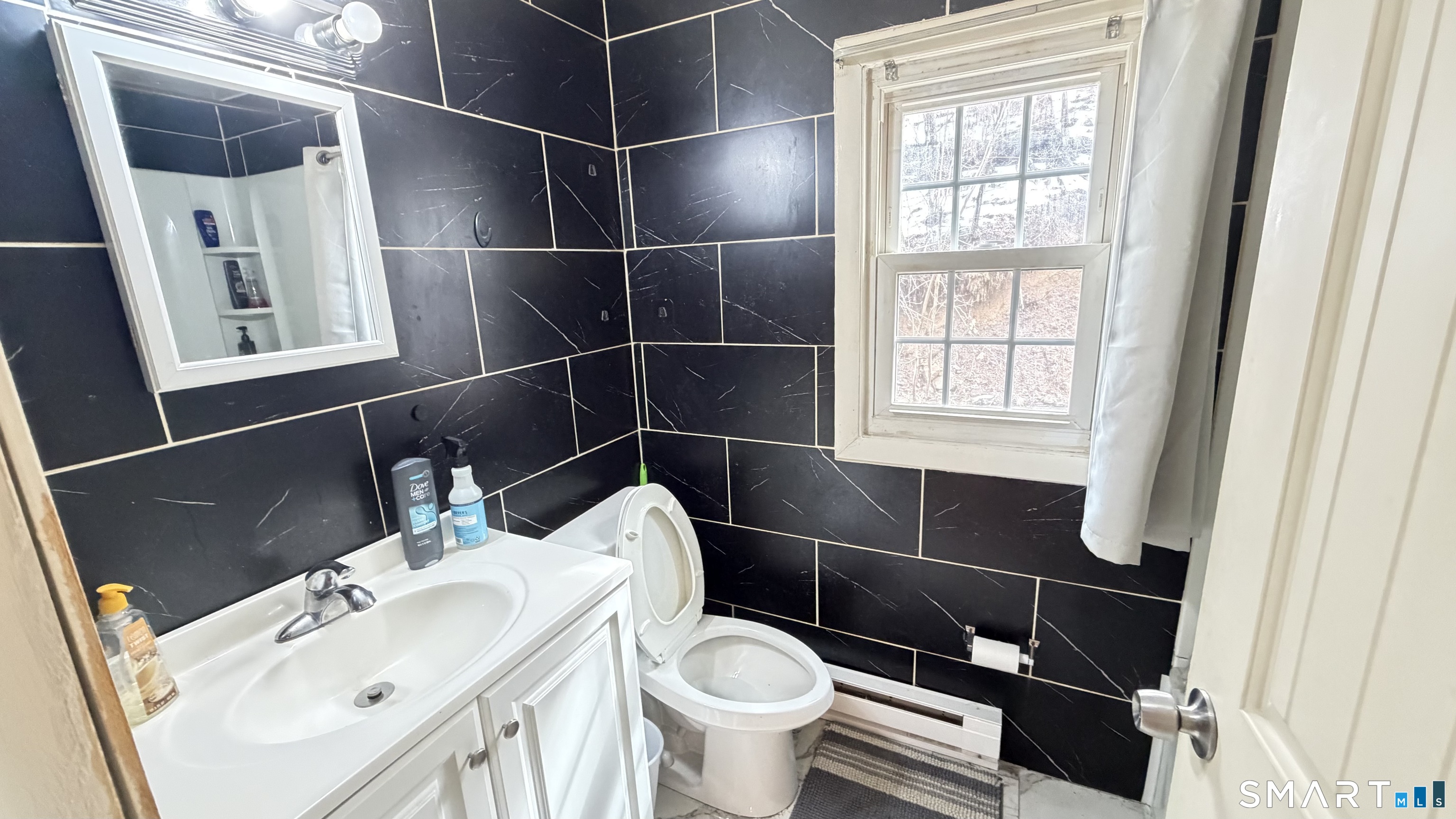 646 Howe Avenue, Unit 23 Shelton, CT 06484 - Photo 14 of 33 a bathroom with a toilet and a sink