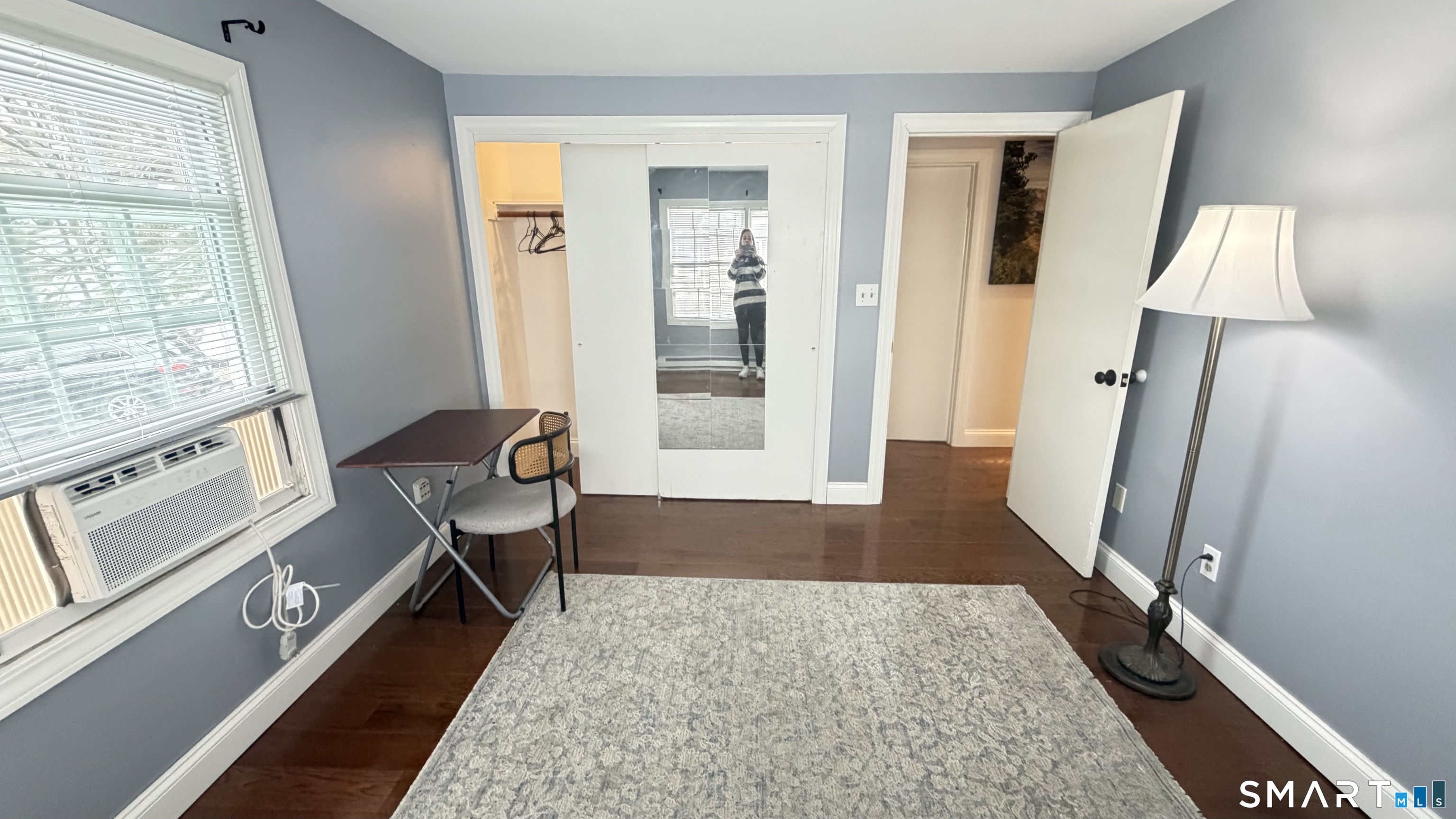 646 Howe Avenue, Unit 23 Shelton, CT 06484 - Photo 20 of 33 a living room with a bed furniture and a large window