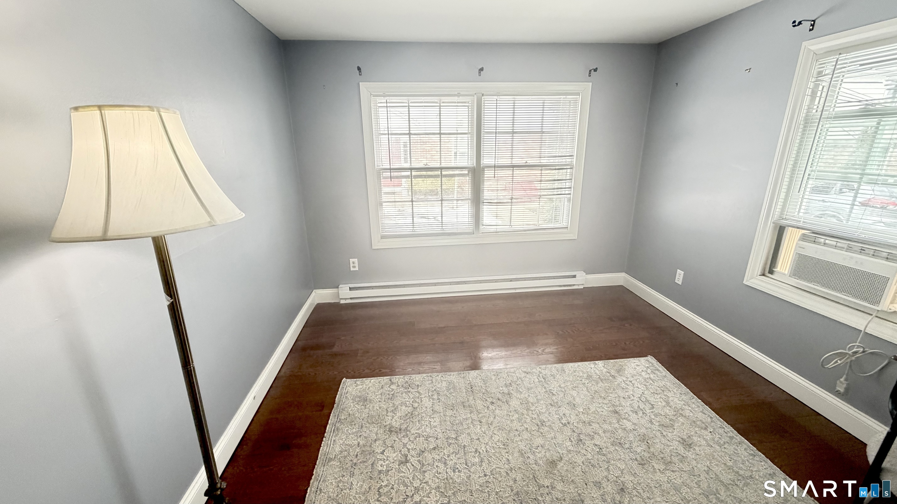 646 Howe Avenue, Unit 23 Shelton, CT 06484 - Photo 22 of 33 wooden floor in an empty room with a window