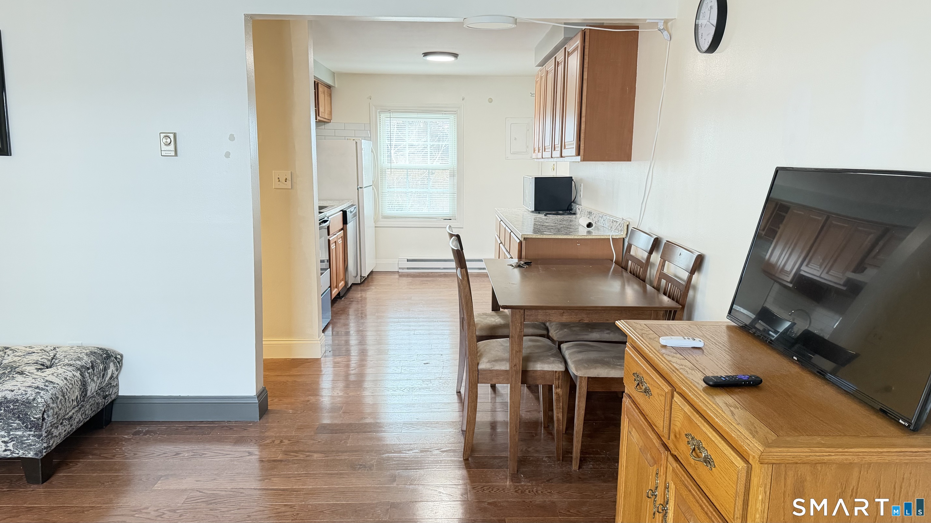 646 Howe Avenue, Unit 23 Shelton, CT 06484 - Photo 6 of 33 a view of kitchen and dining room with wooden floor