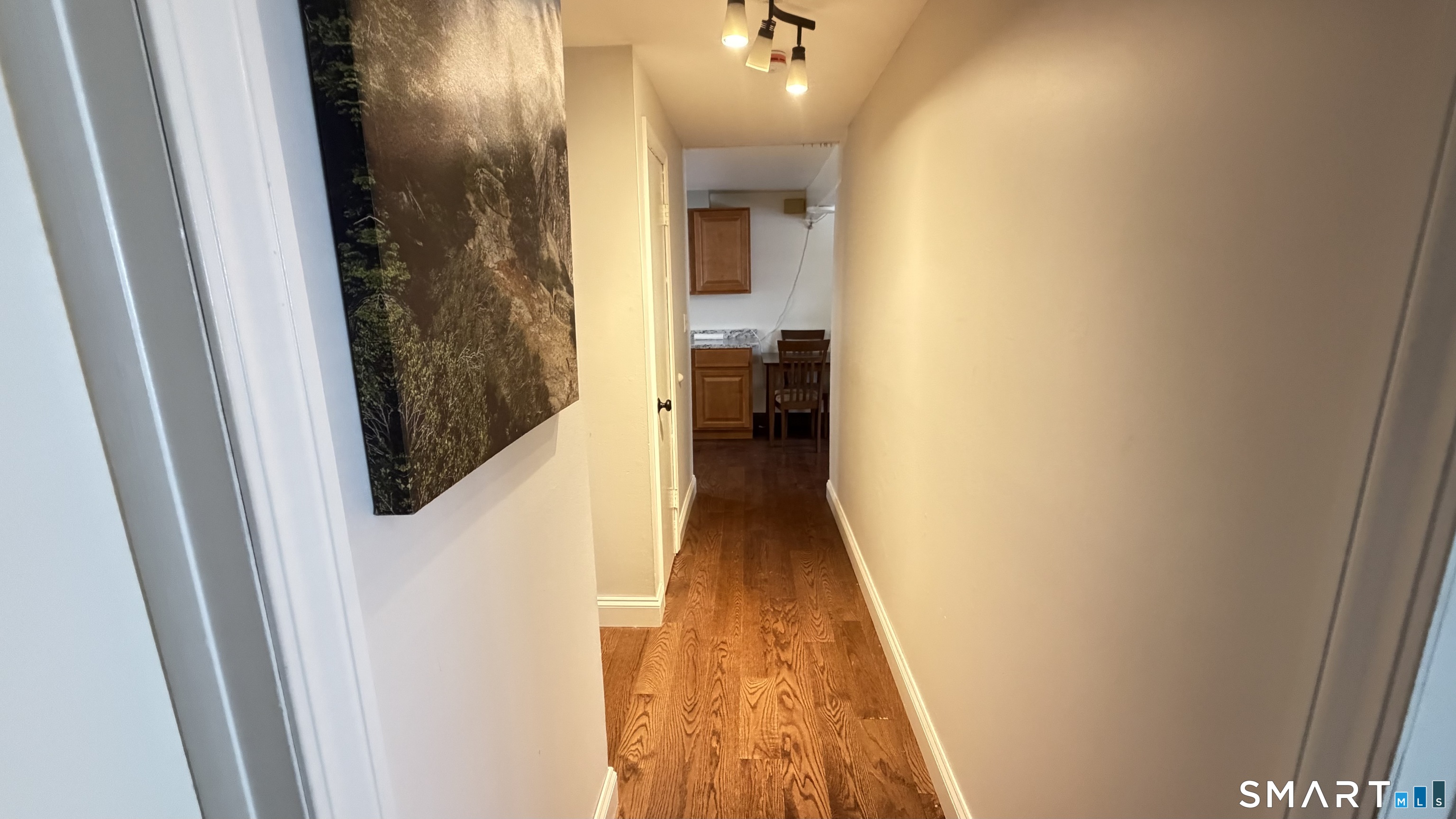646 Howe Avenue, Unit 23 Shelton, CT 06484 - Photo 7 of 33 a view of a hallway with wooden floor