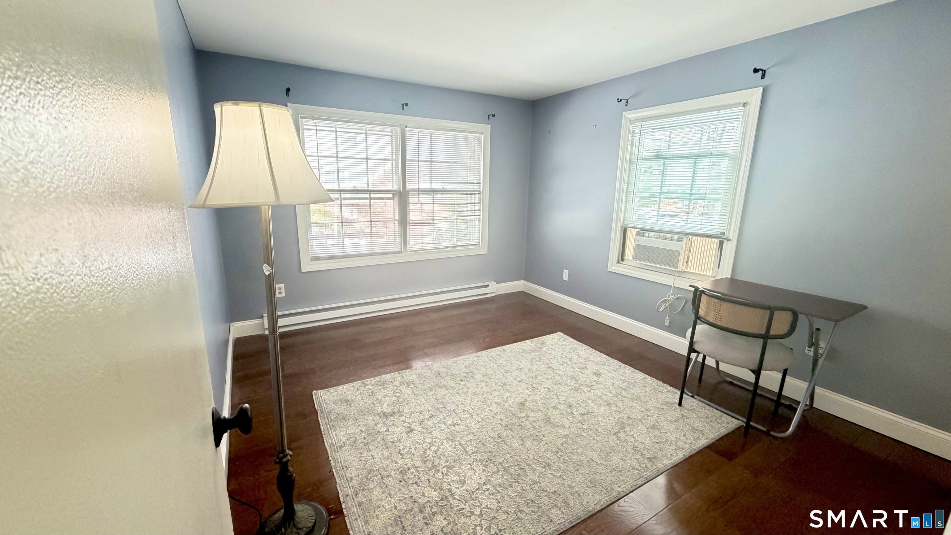 646 Howe Avenue, Unit 23 Shelton, CT 06484 - Photo 9 of 33 a view of a room with wooden floor and windows