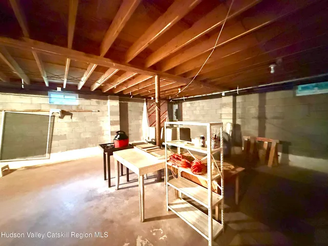 a view of a patio with table and chairs with wooden floor and fence