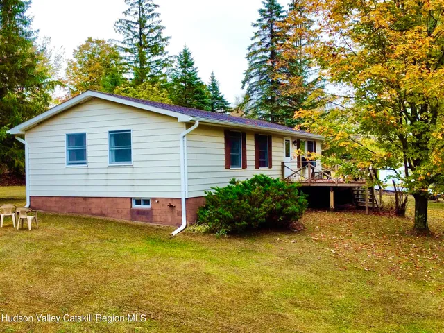 a aerial view of a house with swimming pool and sitting area