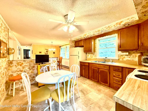 a kitchen with stainless steel appliances kitchen island granite countertop a sink and cabinets