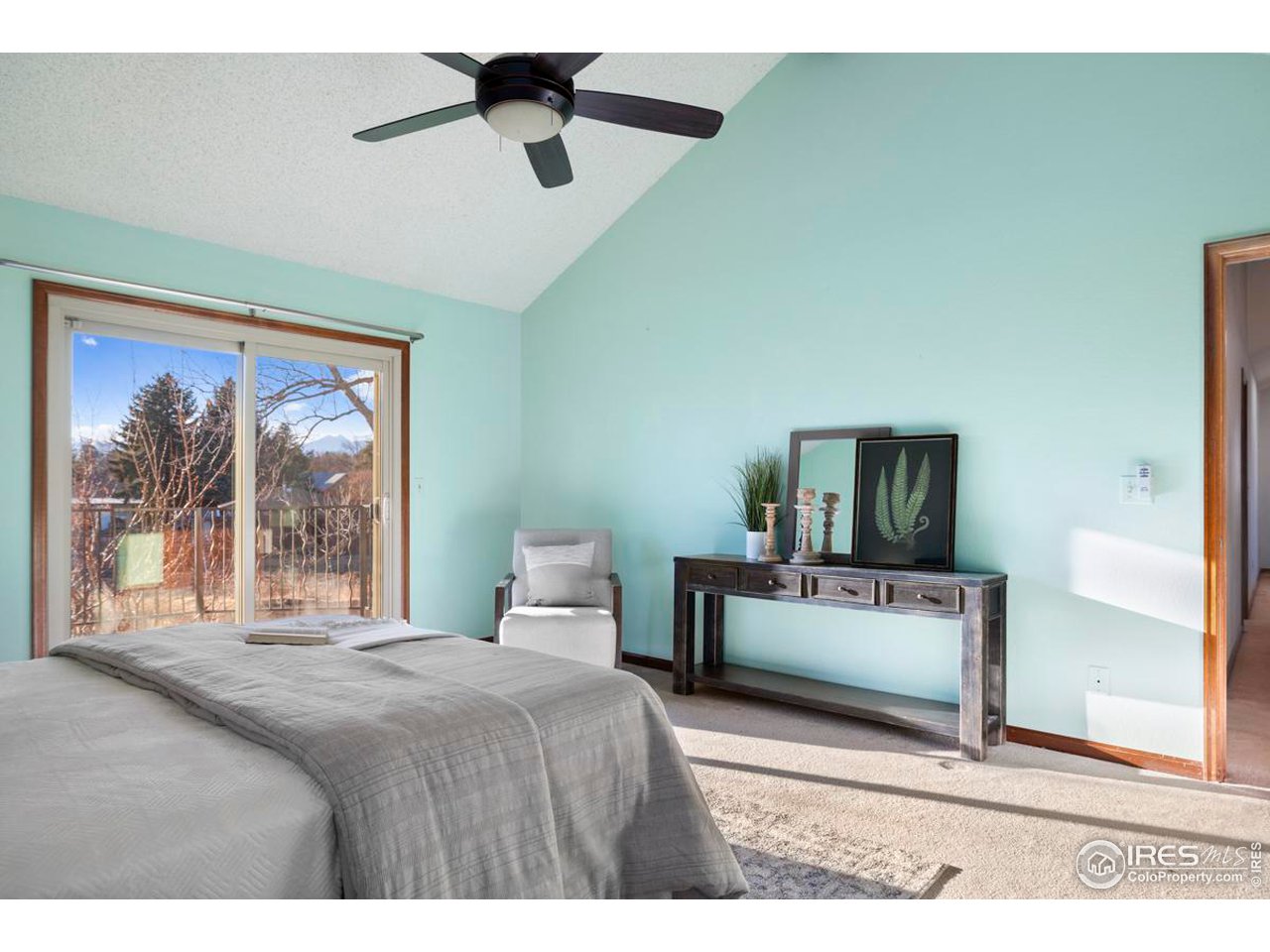 2713 Beech Way Longmont, CO 80503 - Photo 21 of 36 a bedroom with a bed and a painting on the wall