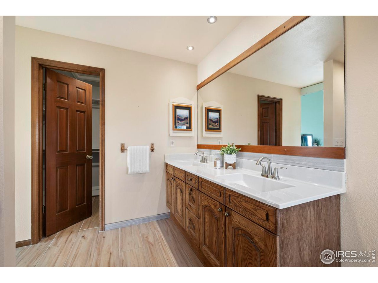 2713 Beech Way Longmont, CO 80503 - Photo 23 of 36 a bathroom with a sink double vanity granite and a mirror