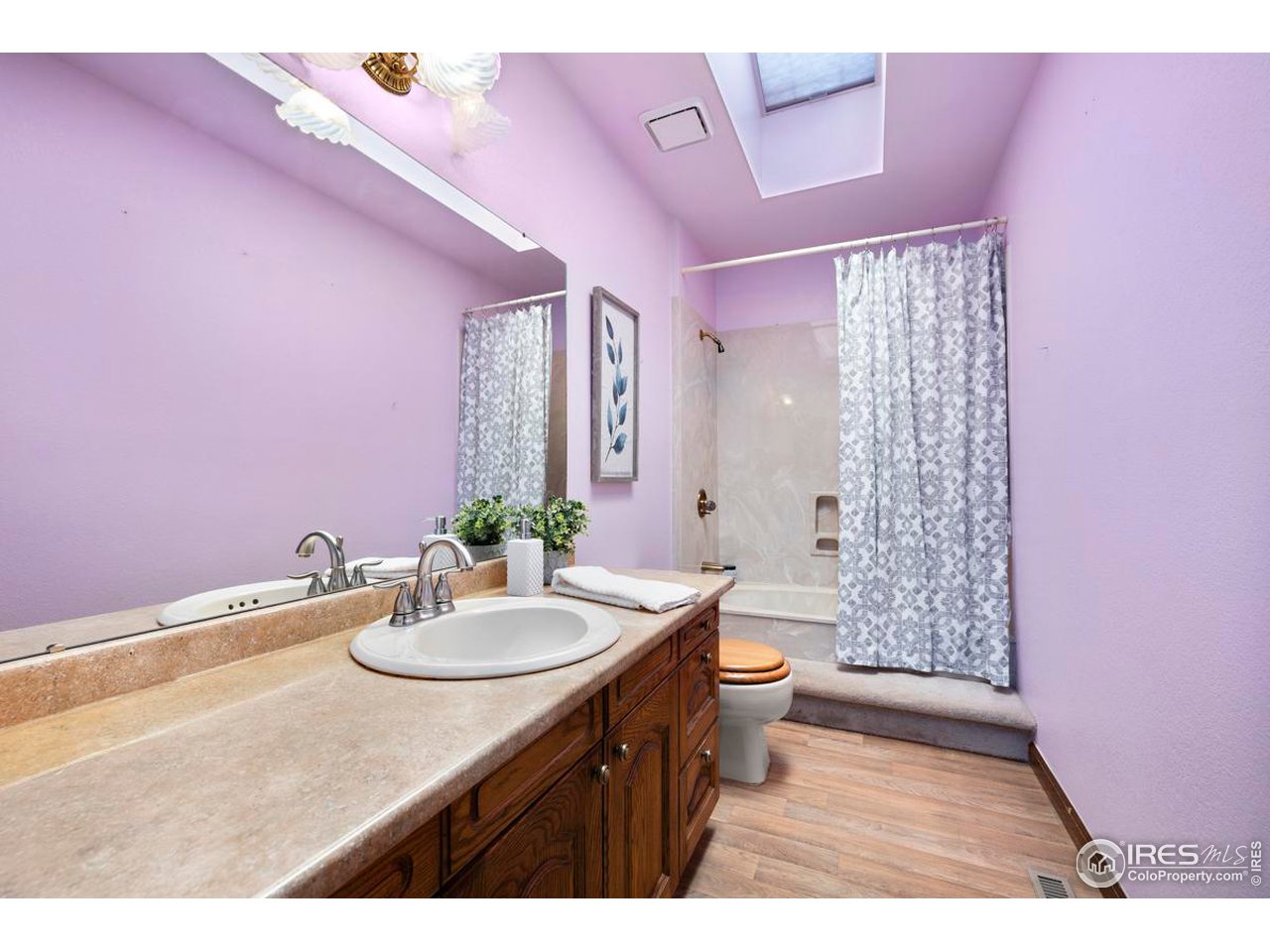 2713 Beech Way Longmont, CO 80503 - Photo 27 of 36 a bathroom with a sink a toilet and shower