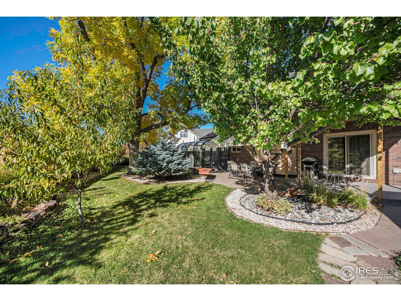 2713 Beech Way Longmont, CO 80503 - Photo 34 of 36 a view of a house with backyard sitting area and garden