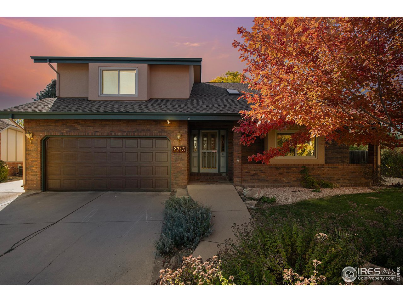 2713 Beech Way Longmont, CO 80503 - Photo 36 of 36 a front view of a house with yard