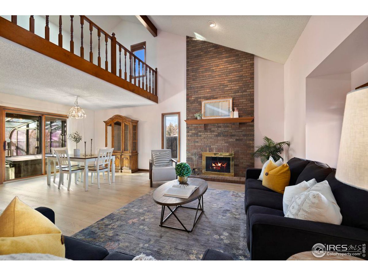 2713 Beech Way Longmont, CO 80503 - Photo 7 of 36 a living room with furniture and a fireplace