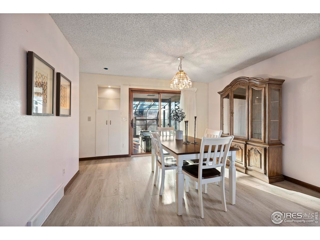 2713 Beech Way Longmont, CO 80503 - Photo 9 of 36 a dining room with furniture and wooden floor